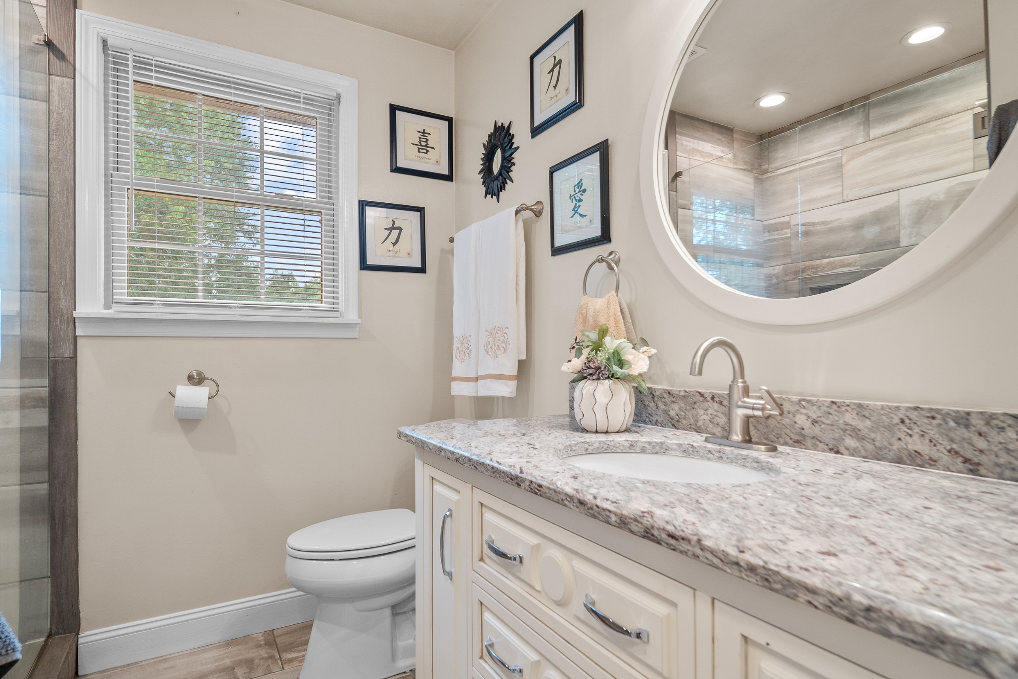 739 Pollard Road Clarksville, TN 37042 - Photo 12 of 41 a bathroom with a granite countertop toilet sink and mirror