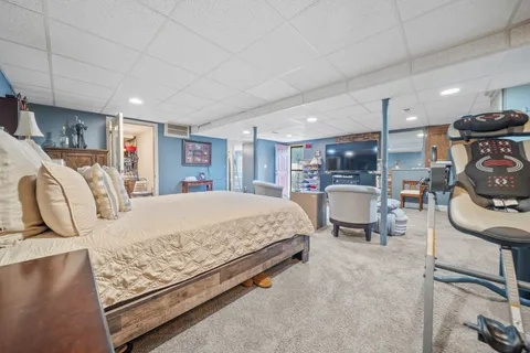 a bed room with a bed and furniture