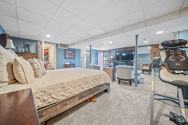 a bed room with a bed and furniture