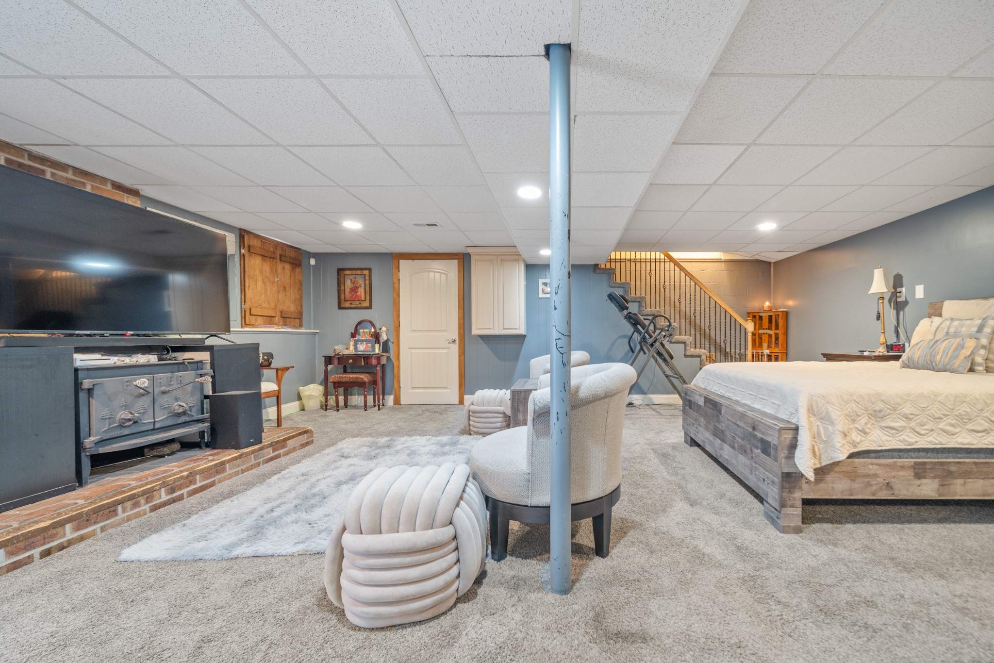 739 Pollard Road Clarksville, TN 37042 - Photo 22 of 41 a bedroom with furniture and a flat screen tv