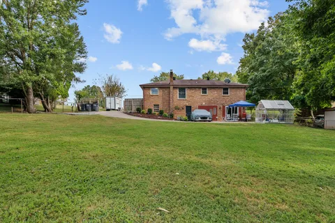 a view of a house with a big yard