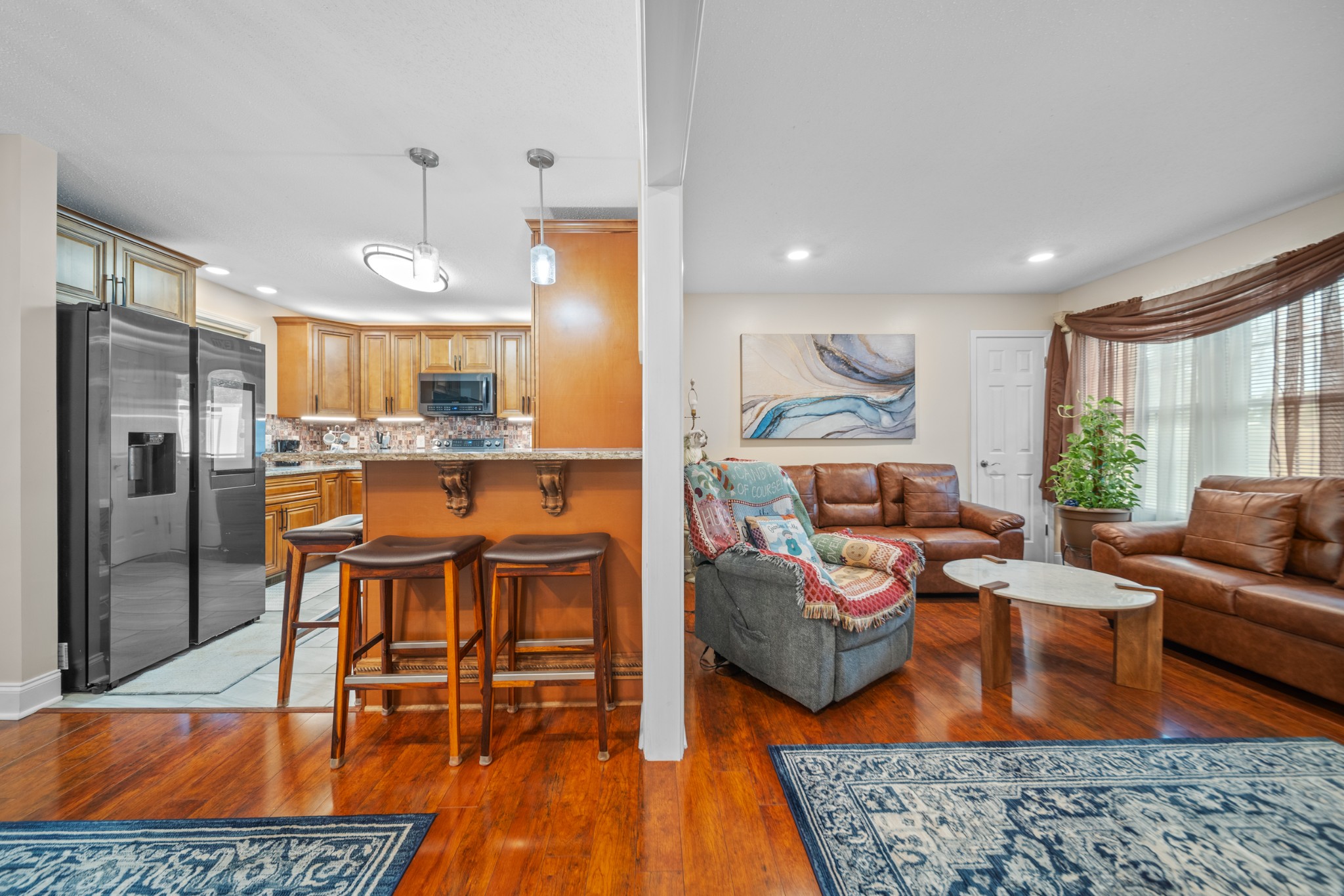 739 Pollard Road Clarksville, TN 37042 - Photo 7 of 41 a living room with furniture and a wooden floor