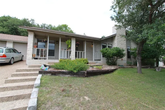 a house view with a garden space