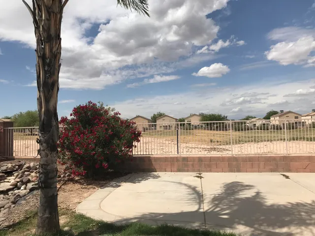 a view of a house with a yard covered with snow