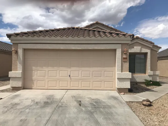 a view of a house with a door and a outdoor space