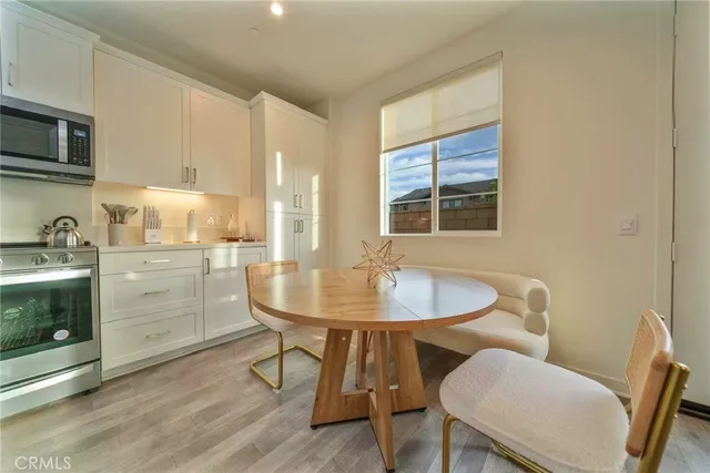 a dining room with furniture and window