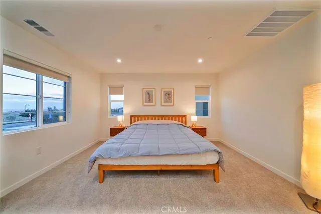 a room with pool table and windows