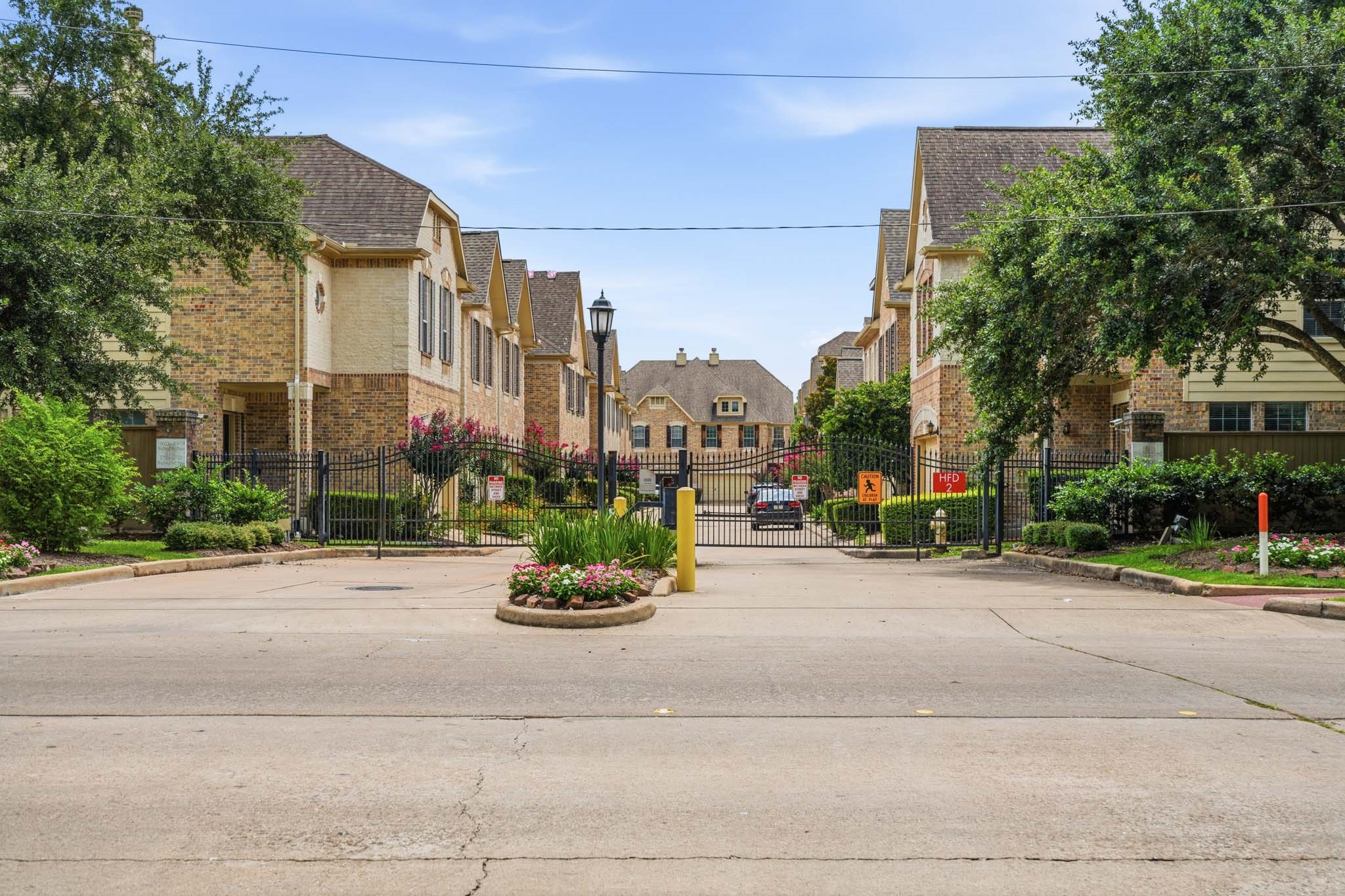 2711 Wallingford Pines Houston, TX 77042 - Photo 7 of 8 a view of a street with a cars park side of a road