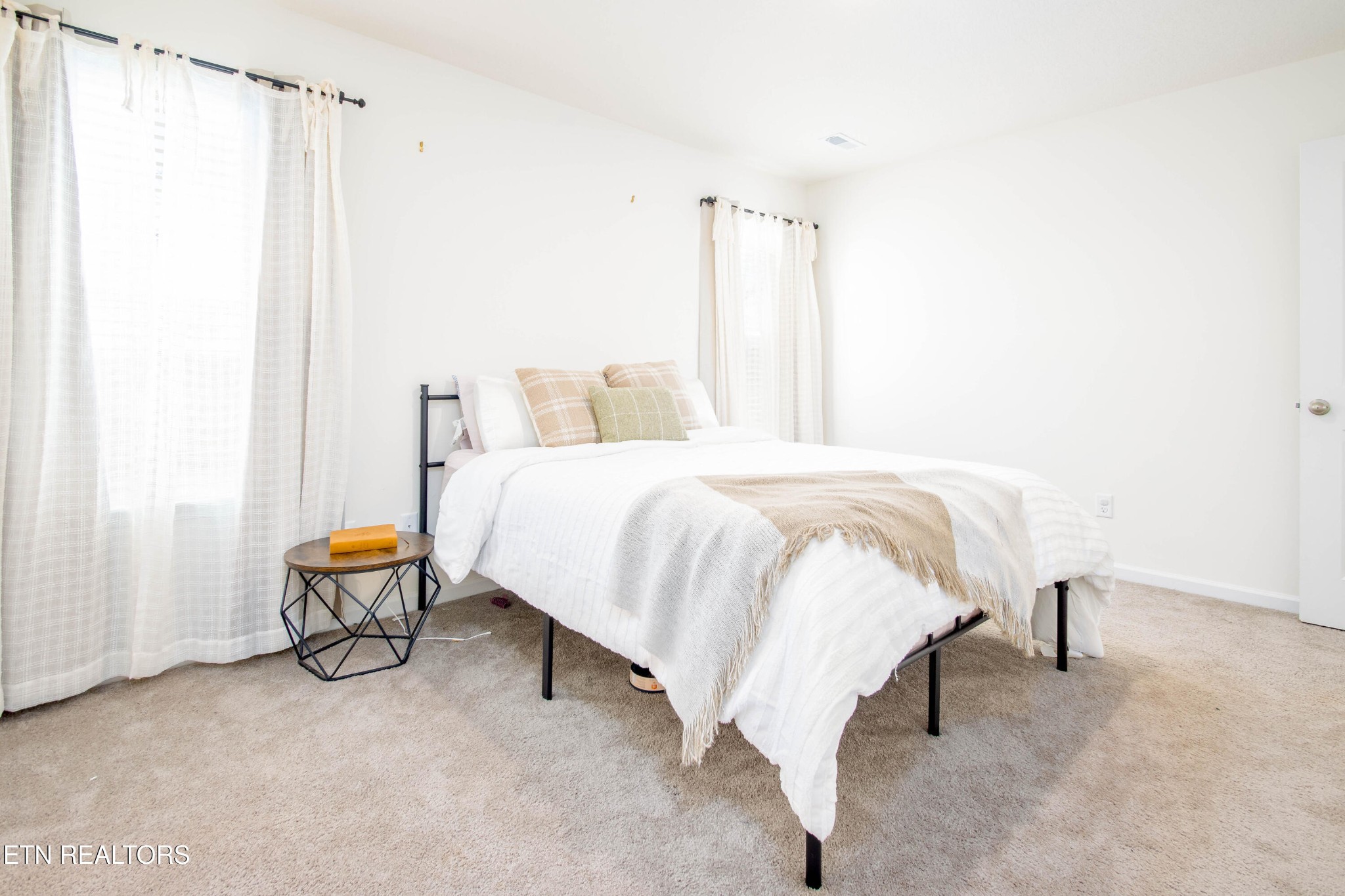 7535 Grasshopper Lane Corryton, TN 37721 - Photo 11 of 28 a bedroom with a bed and mirror