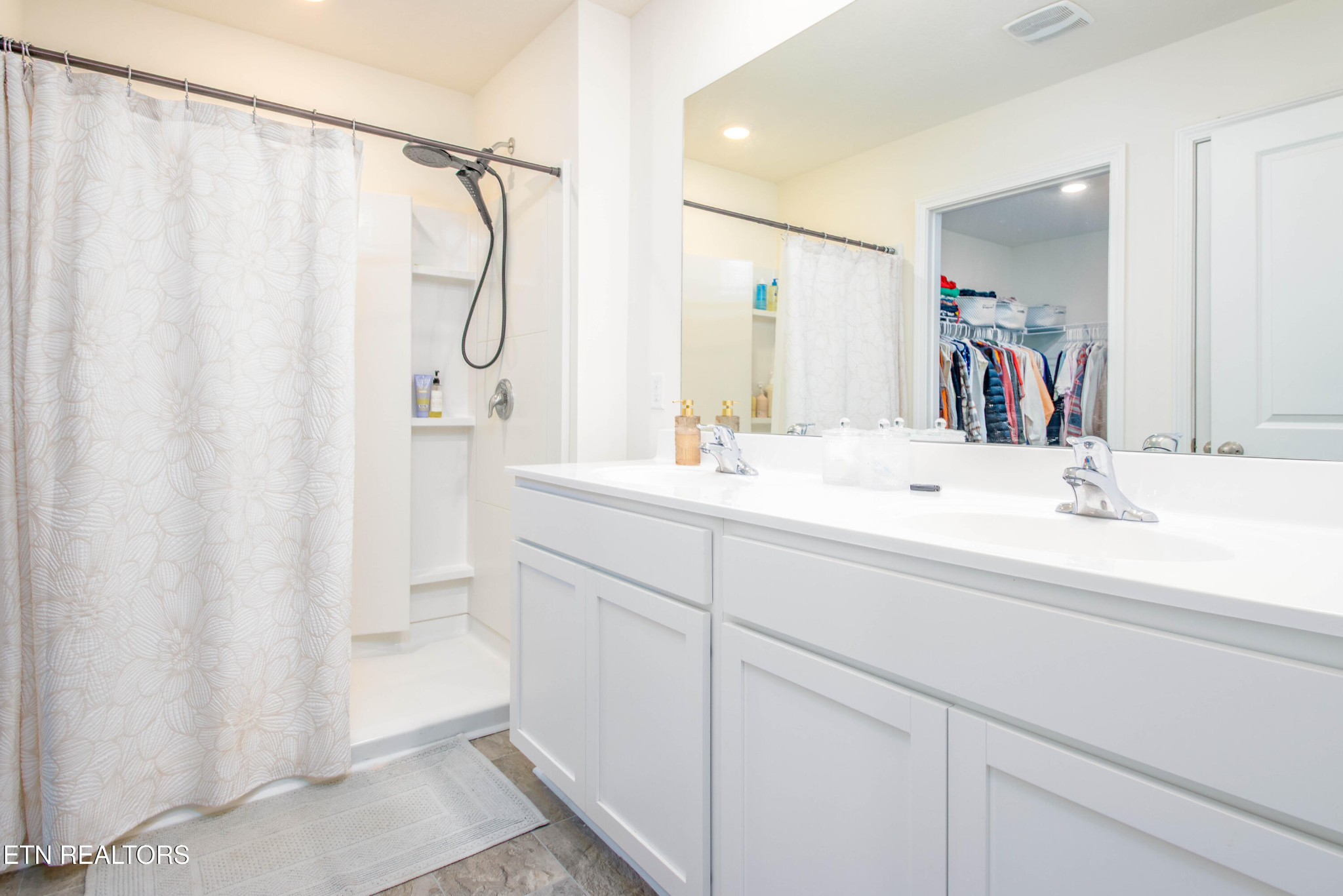 7535 Grasshopper Lane Corryton, TN 37721 - Photo 12 of 28 a bathroom with a double vanity sink mirror and double