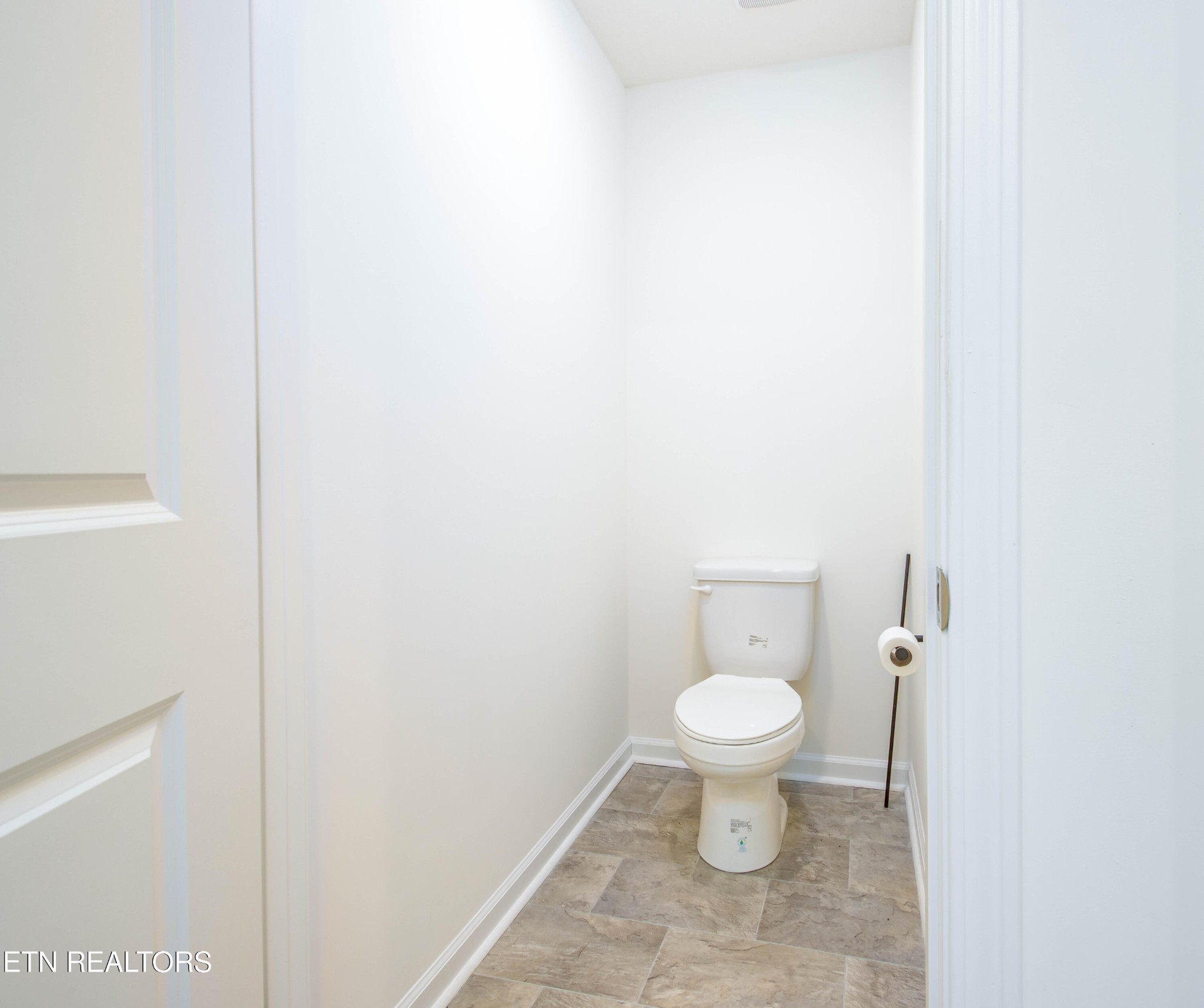 7535 Grasshopper Lane Corryton, TN 37721 - Photo 13 of 28 a white toilet sitting next to a white walls