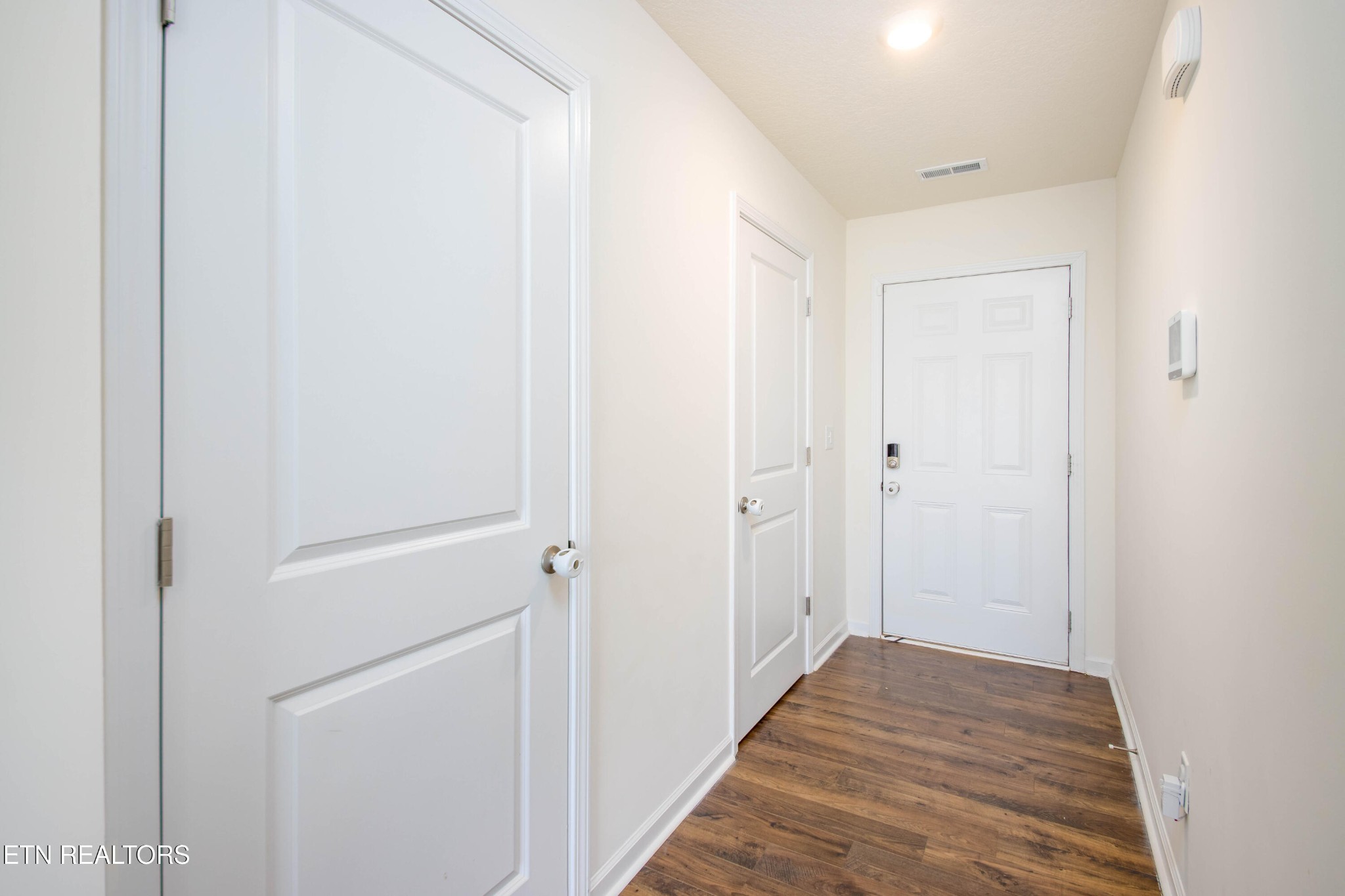 7535 Grasshopper Lane Corryton, TN 37721 - Photo 6 of 28 a view of a hallway with wooden floor
