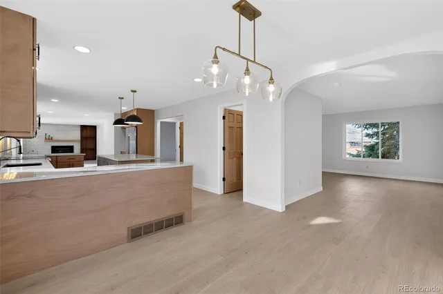 a view of livingroom and kitchen with hardwood floor