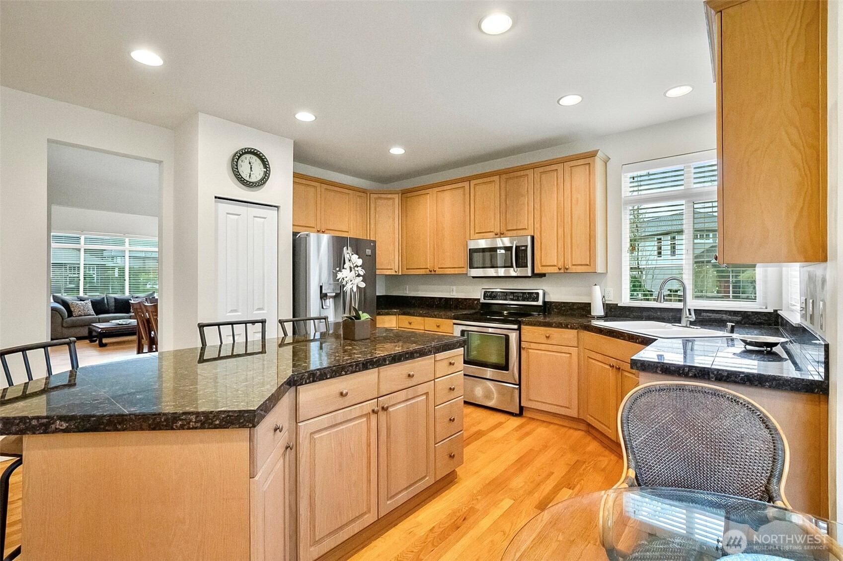 17401 33rd Drive Southeast Bothell, WA 98012 - Photo 13 of 39 a kitchen with stainless steel appliances granite countertop sink stove refrigerator and cabinets