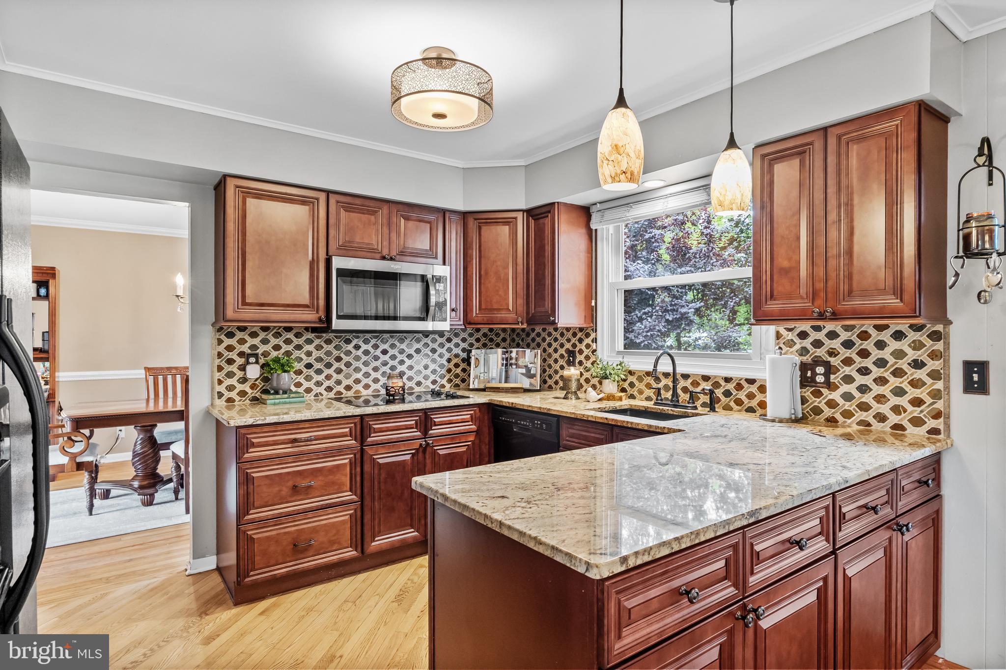 803 Charleston Road Mount Laurel, NJ 08054 - Photo 12 of 36 a kitchen with granite countertop a sink and a stove