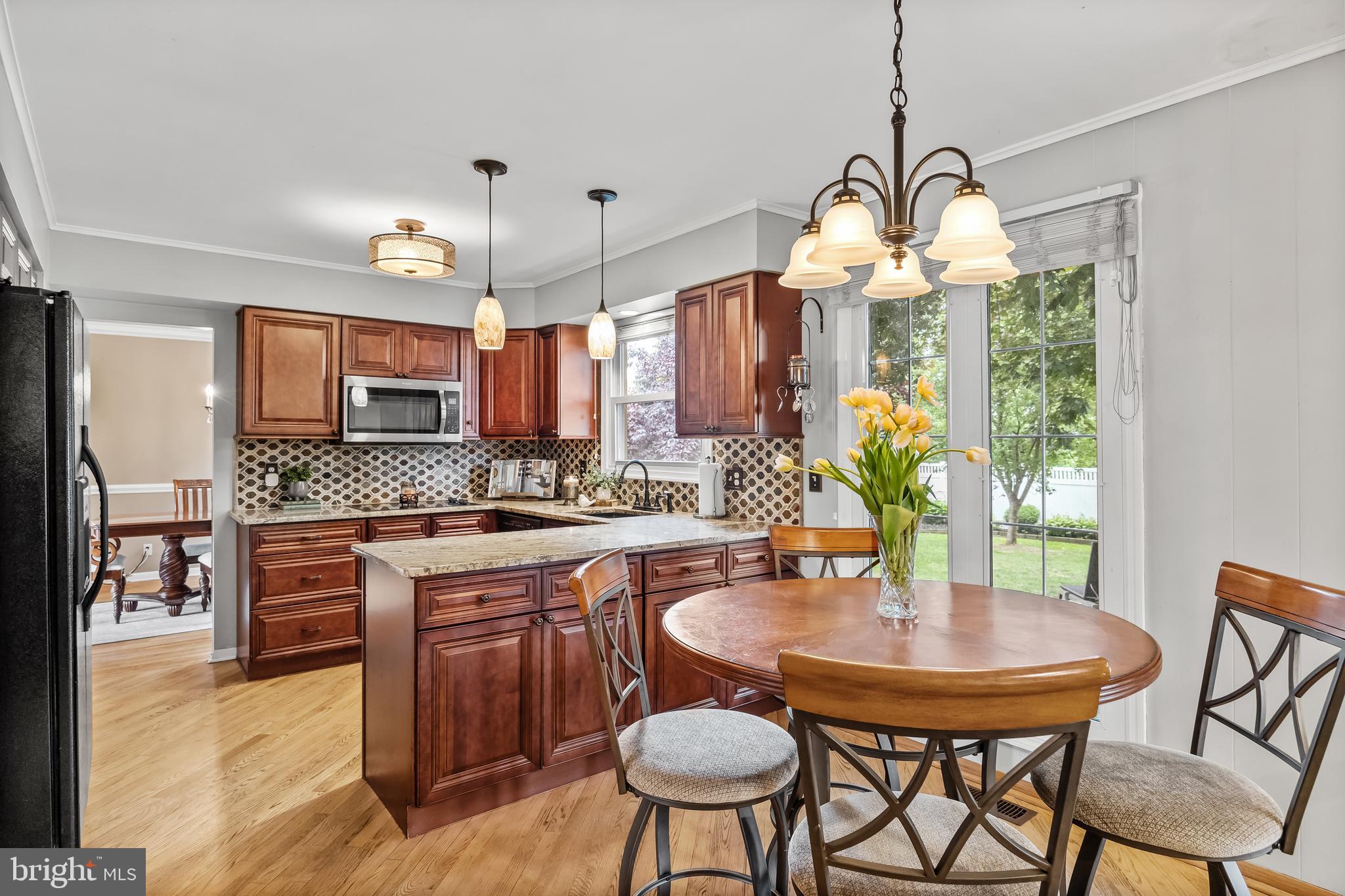 803 Charleston Road Mount Laurel, NJ 08054 - Photo 14 of 36 a kitchen with stainless steel appliances granite countertop a kitchen island a stove a table and chairs
