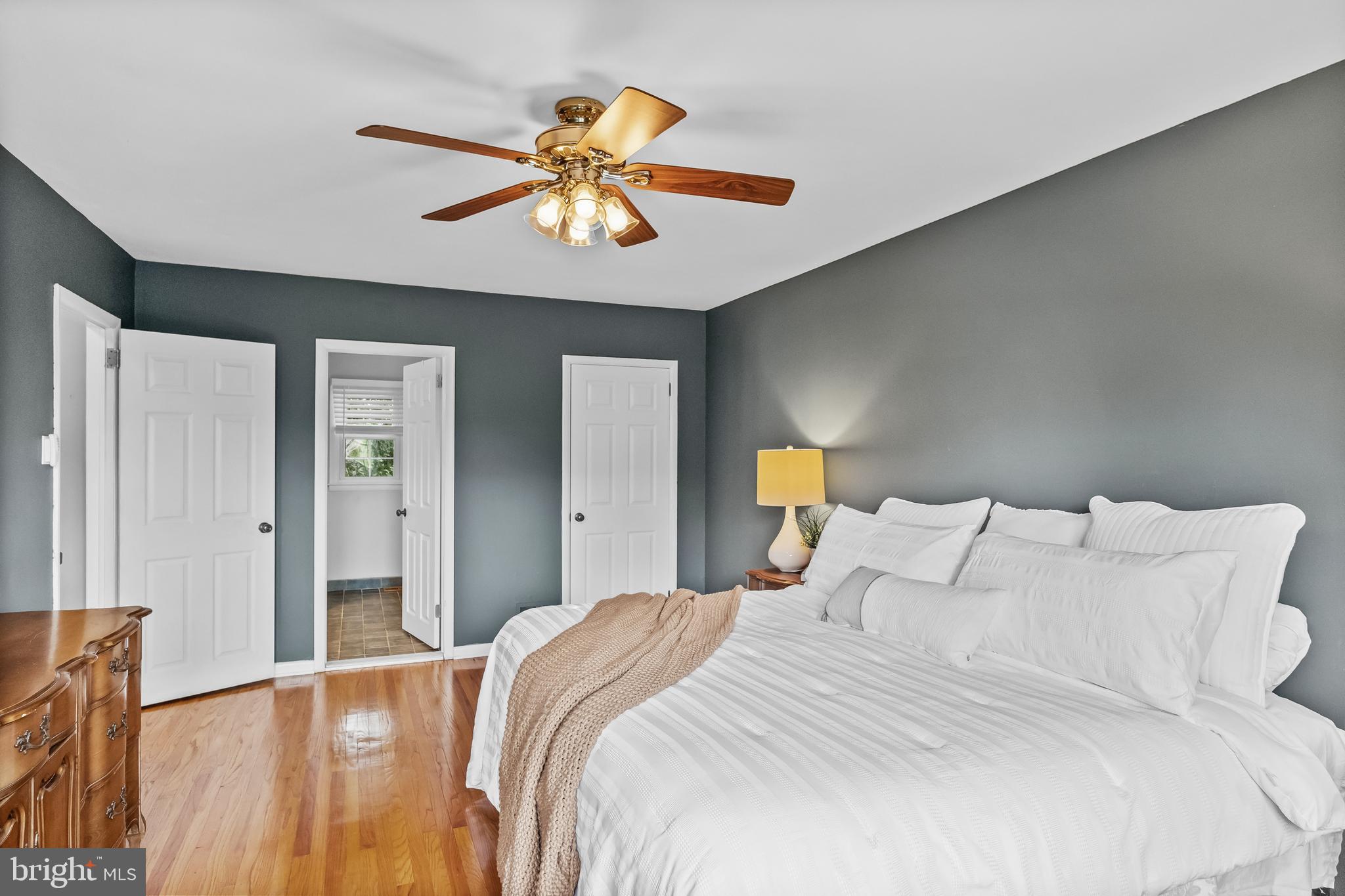 803 Charleston Road Mount Laurel, NJ 08054 - Photo 22 of 36 a bedroom with a large bed and a chandelier