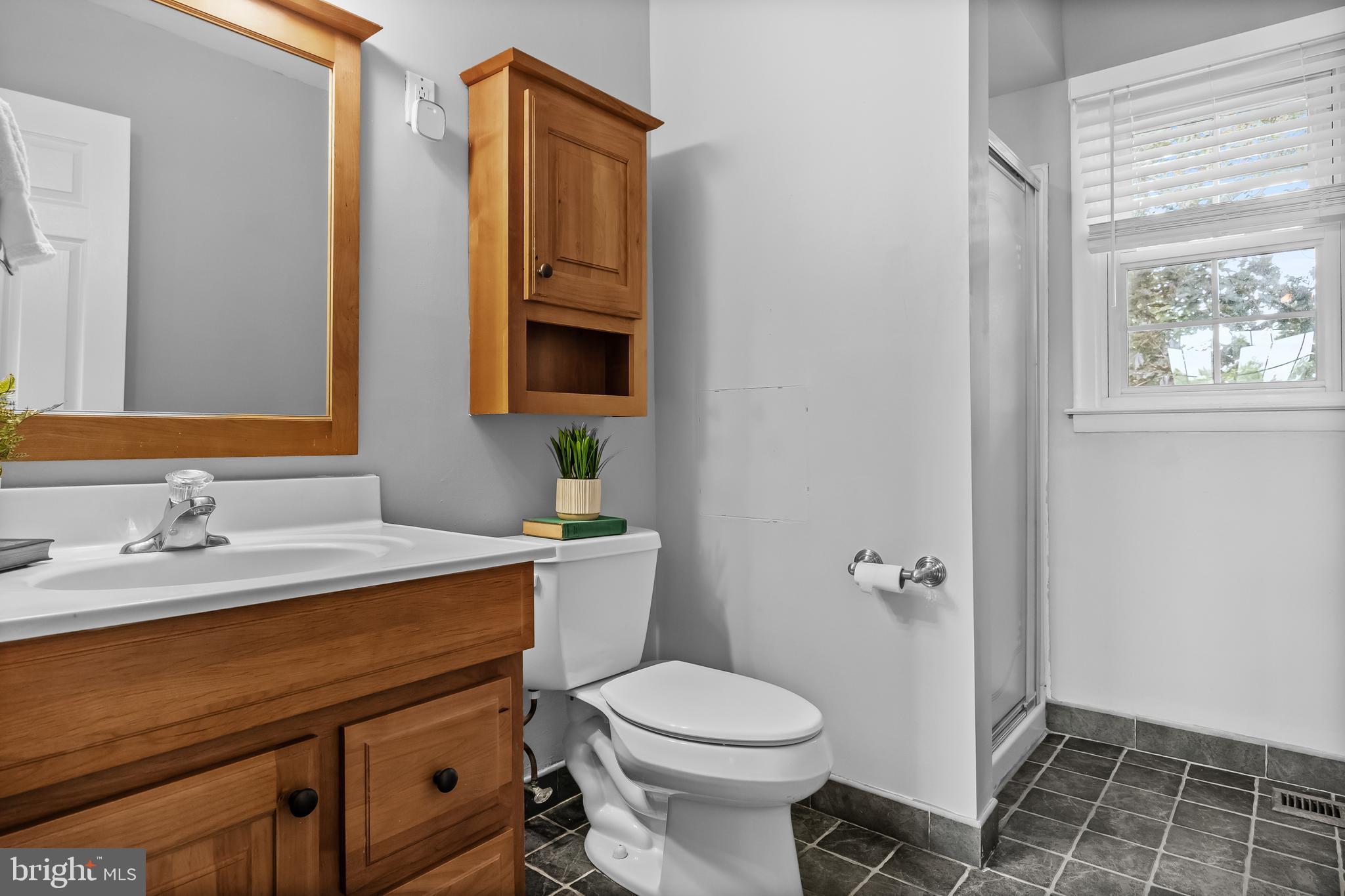 803 Charleston Road Mount Laurel, NJ 08054 - Photo 23 of 36 a bathroom with a granite countertop toilet sink and mirror
