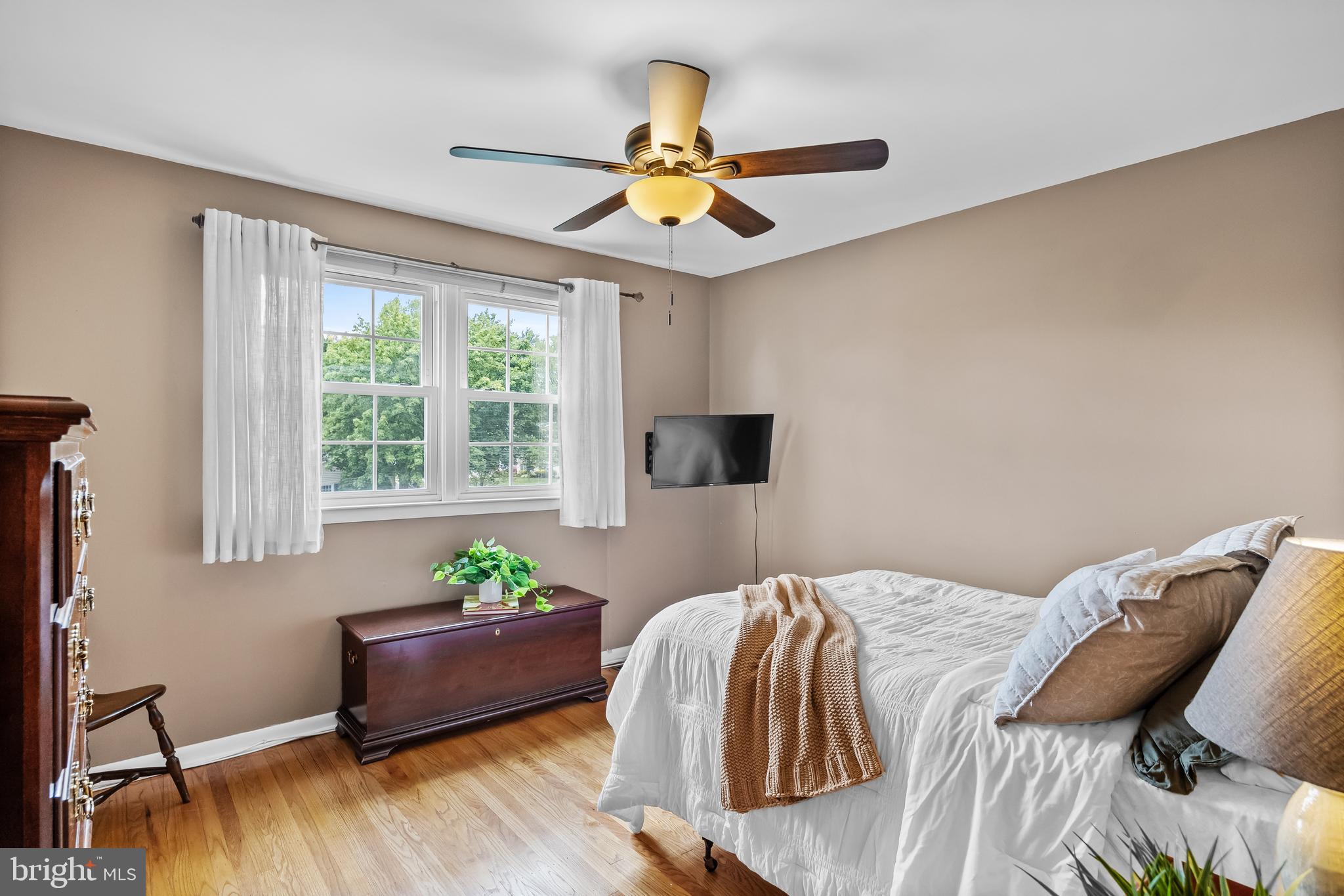 803 Charleston Road Mount Laurel, NJ 08054 - Photo 26 of 36 a bedroom with a bed a chandelier and a window