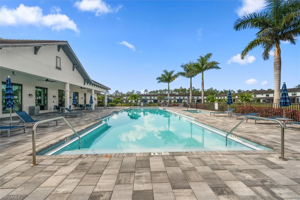 7546 Rockefeller Drive Naples, FL 34119 - Photo 28 of 31 Community pool featuring a patio area and ceiling fan