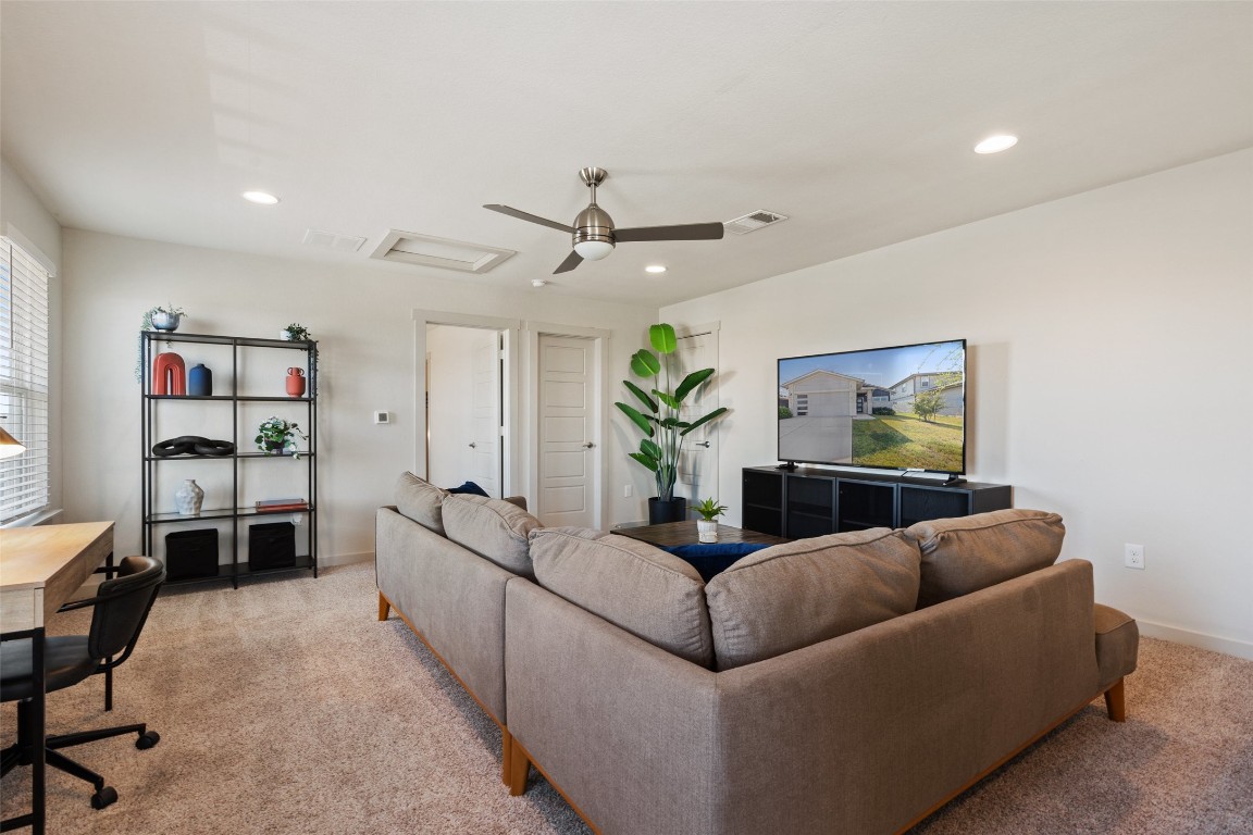 8313 City Top Boulevard Austin, TX 78724 - Photo 21 of 37 a living room with furniture and a ceiling fan