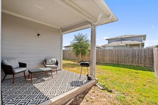 a view of a swimming pool with a lounge chair