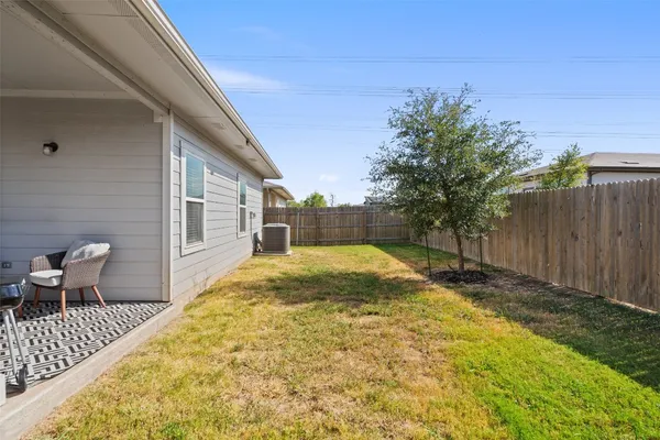 a view of backyard with seating space