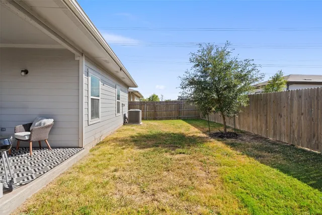 a view of backyard with seating space