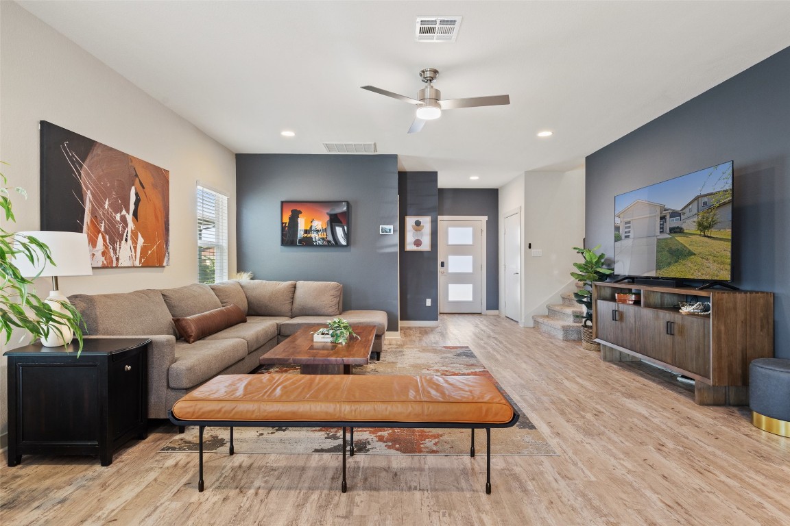 8313 City Top Boulevard Austin, TX 78724 - Photo 6 of 37 a living room with furniture and a flat screen tv