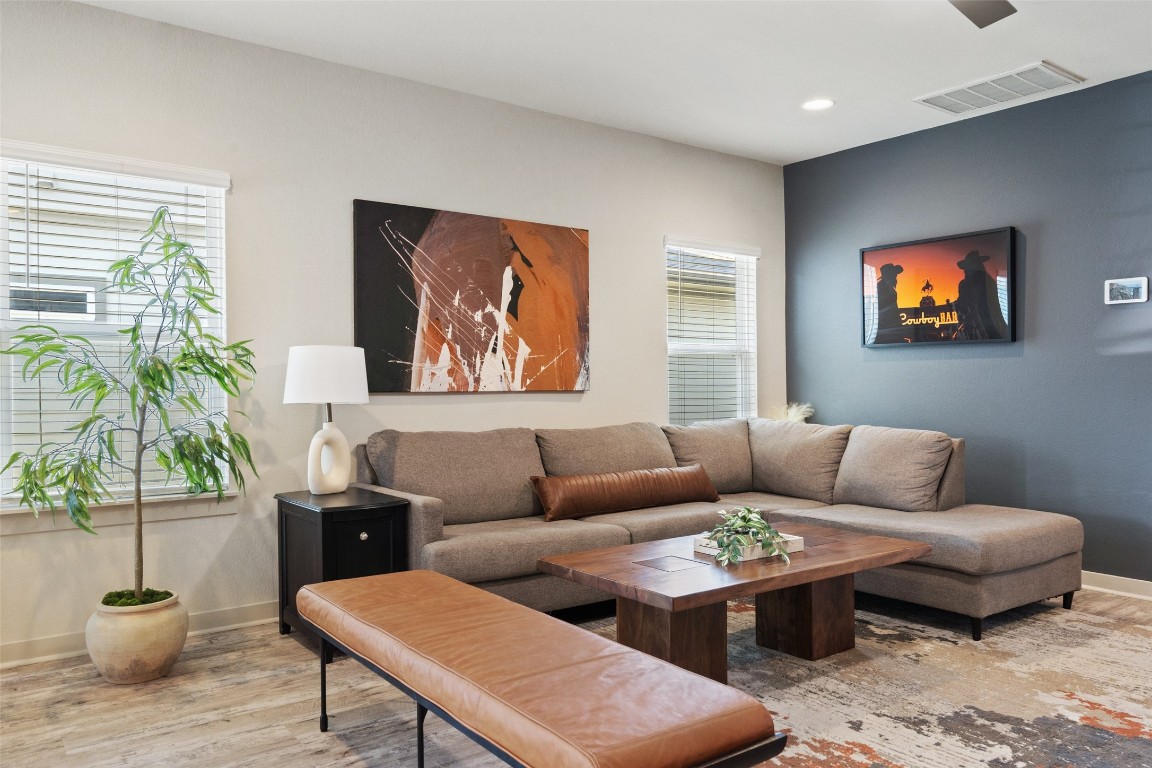 8313 City Top Boulevard Austin, TX 78724 - Photo 8 of 37 a living room with furniture potted plant and a window