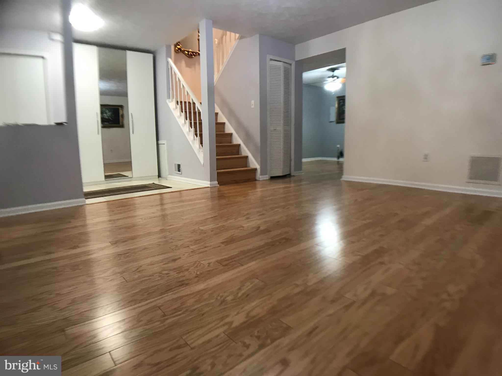 8970 Miles Place Manassas, VA 20110 - Photo 11 of 12 wooden floor in an empty room with glass door