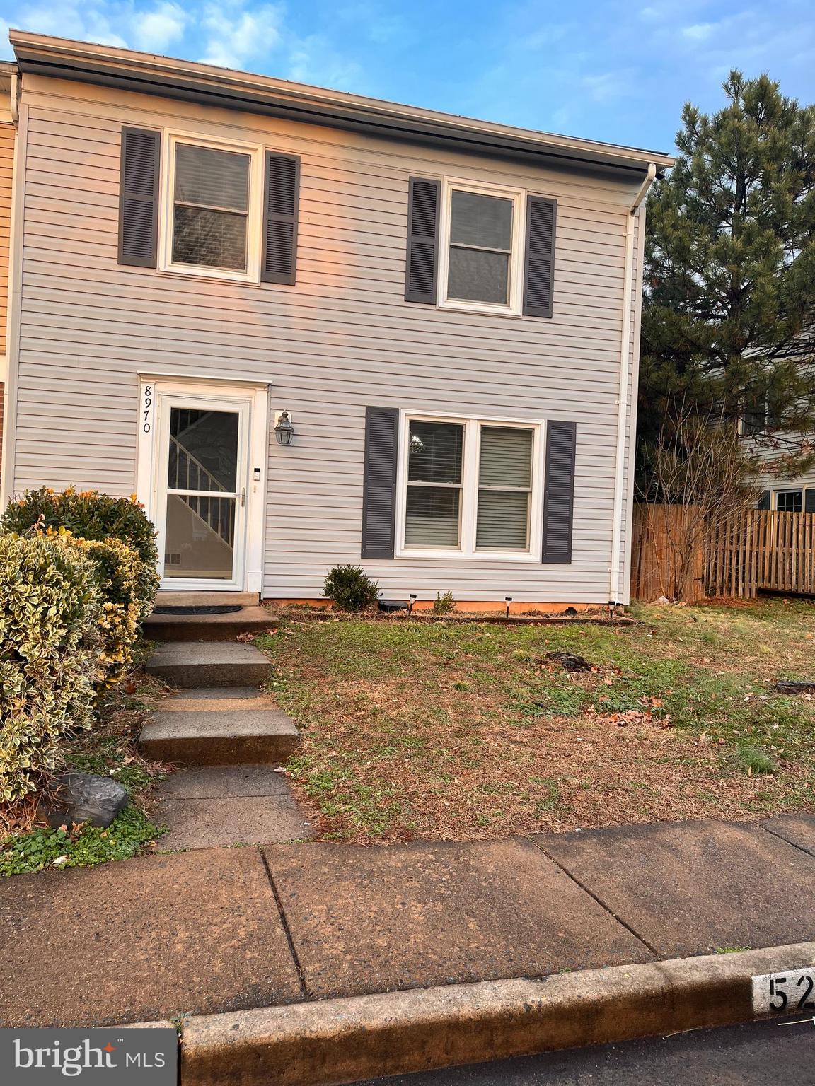 8970 Miles Place Manassas, VA 20110 - Photo 2 of 12 a front view of a house with a yard