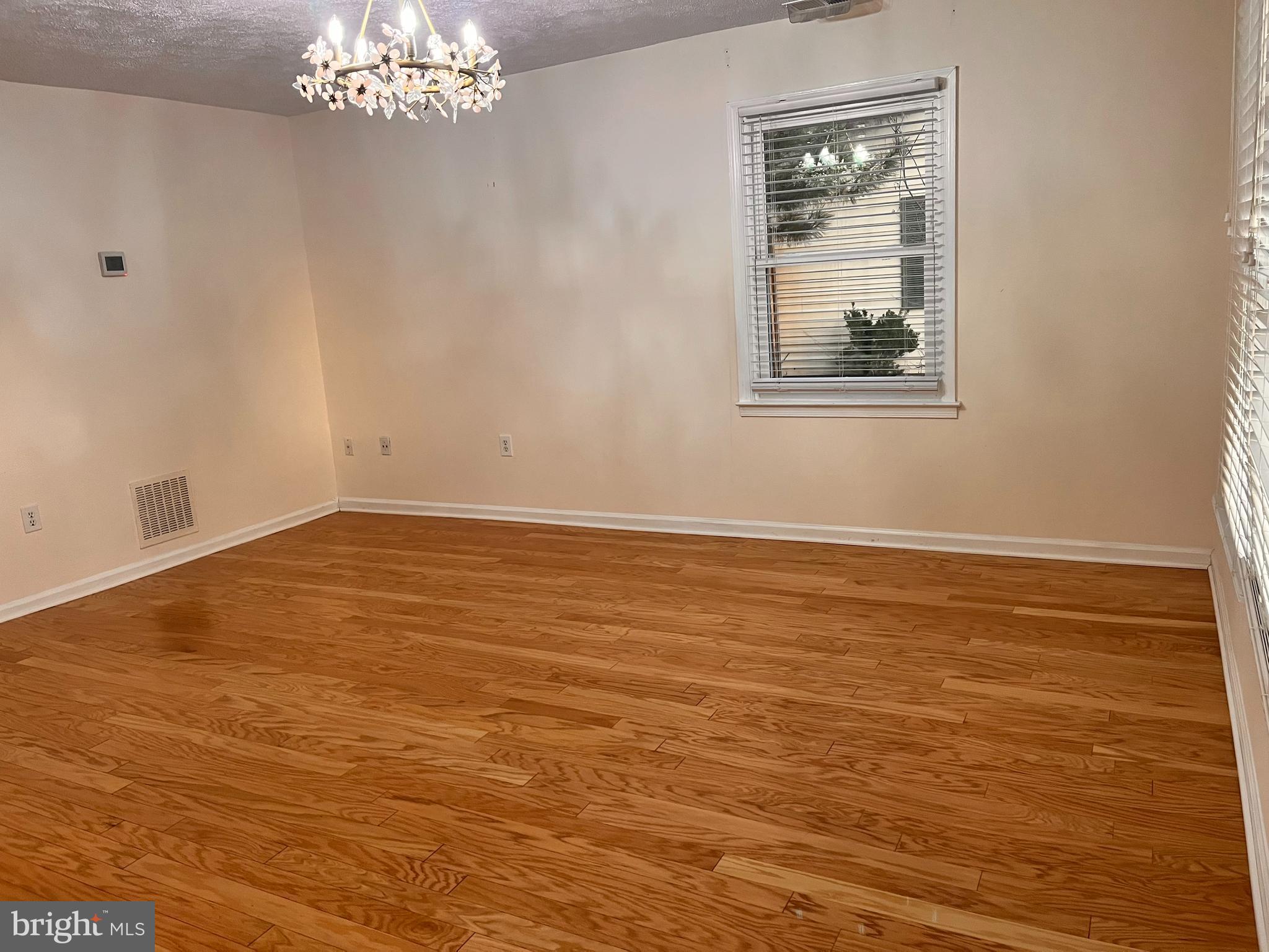 8970 Miles Place Manassas, VA 20110 - Photo 8 of 12 a view of empty room with wooden floor