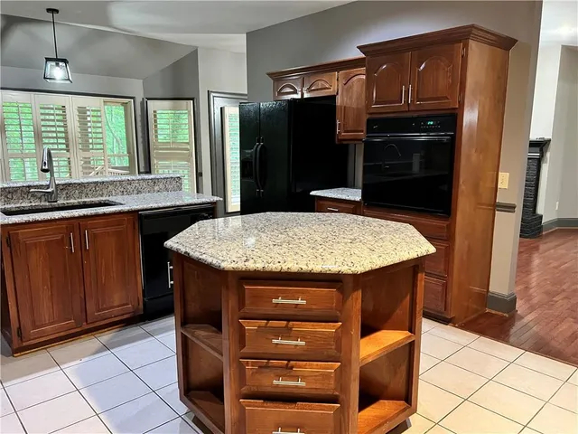 a kitchen with a stove and a sink