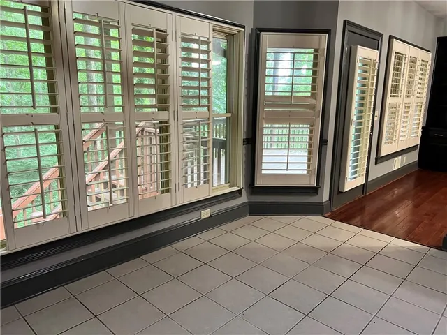 a view of kitchen with a sink and a refrigerator