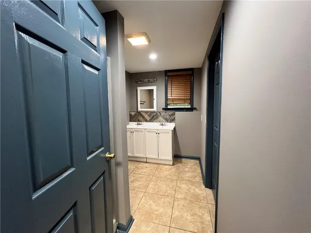a bathroom with a sink toilet and mirror