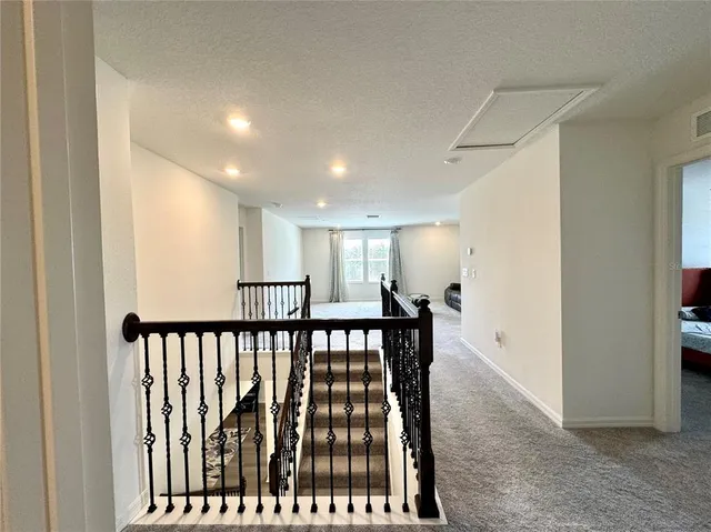 a view of hallway with stairs