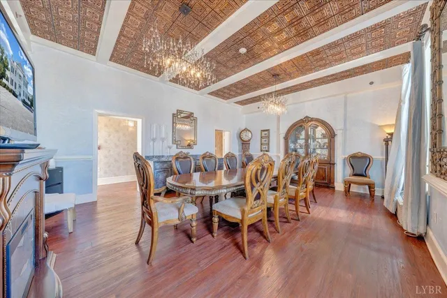 a bedroom with furniture and a wooden floor