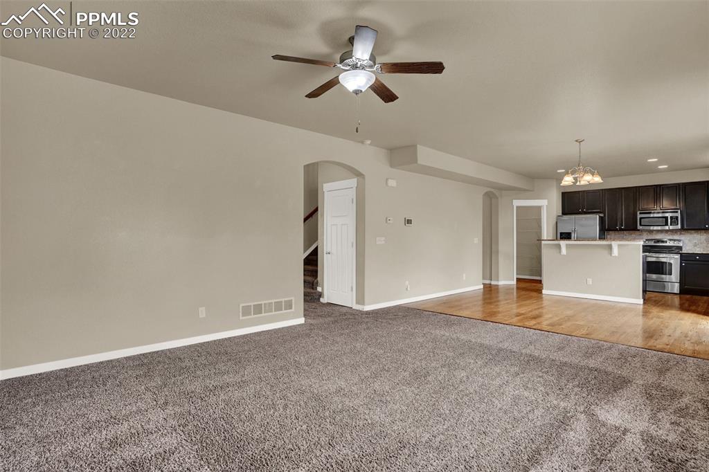 6750 Alliance Loop Colorado Springs, CO 80925 - Photo 14 of 32 a view of an empty room with a kitchen