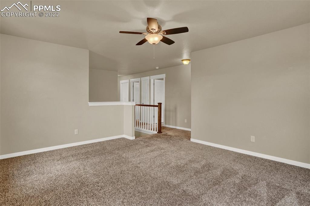 6750 Alliance Loop Colorado Springs, CO 80925 - Photo 16 of 32 an empty room with closet and a ceiling fan