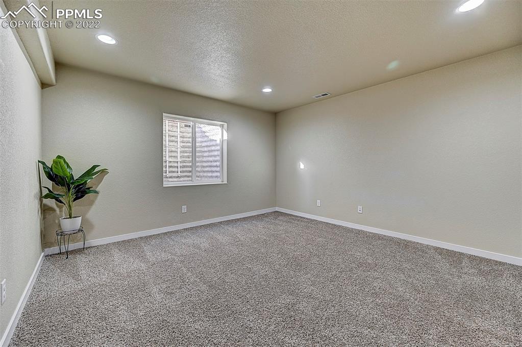 6750 Alliance Loop Colorado Springs, CO 80925 - Photo 29 of 32 a view of an empty room with a window