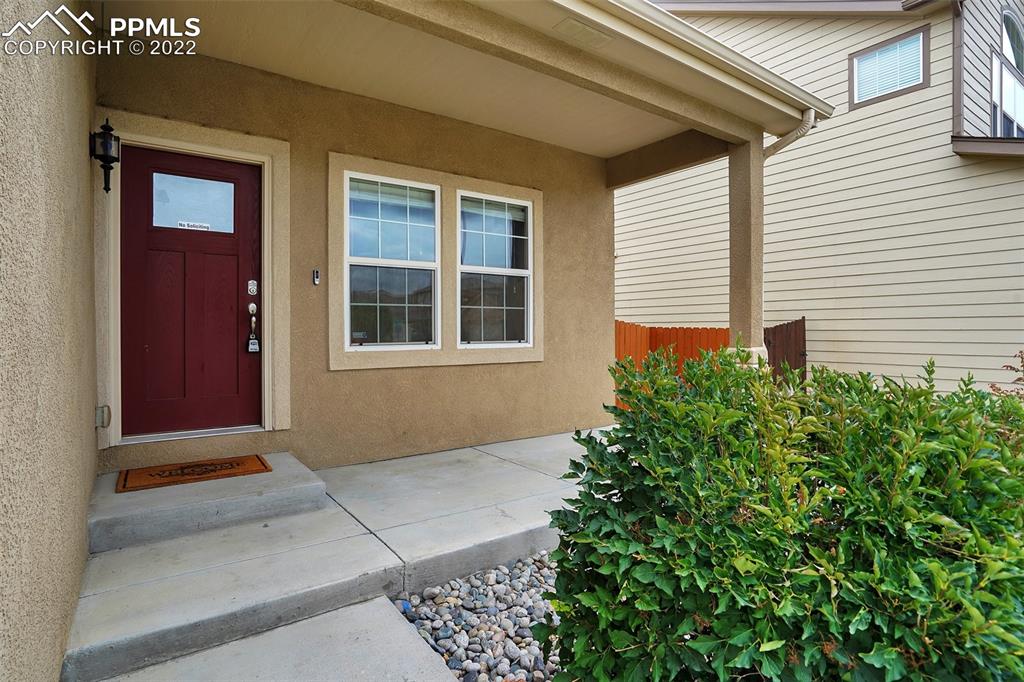 6750 Alliance Loop Colorado Springs, CO 80925 - Photo 3 of 32 a view of front door of house
