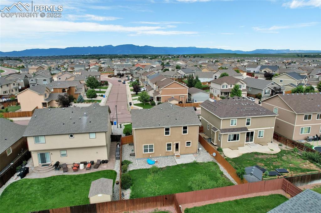 6750 Alliance Loop Colorado Springs, CO 80925 - Photo 31 of 32 an aerial view of multiple houses with yard
