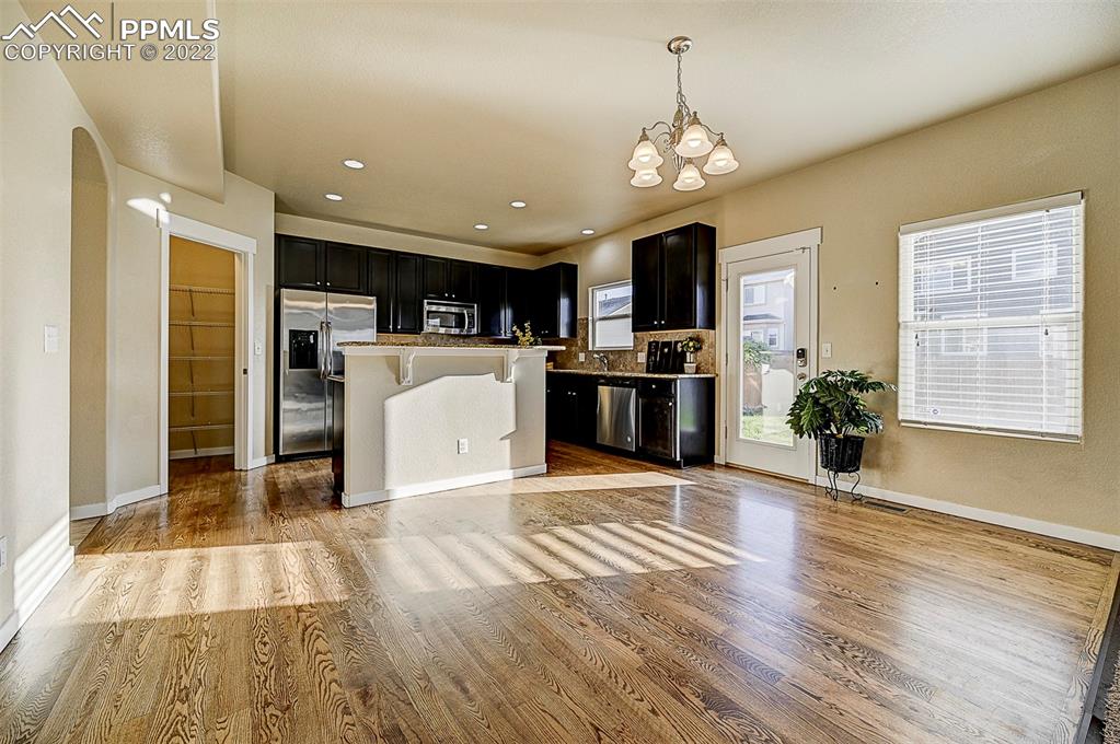 6750 Alliance Loop Colorado Springs, CO 80925 - Photo 9 of 32 a view of a kitchen with microwave and refrigerator
