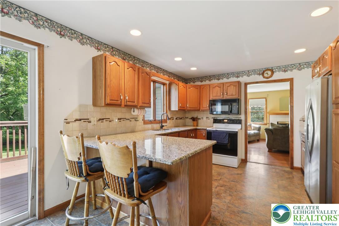 1705 Deer Path Road Easton, PA 18040 - Photo 12 of 42 a large kitchen with a table and chairs in it