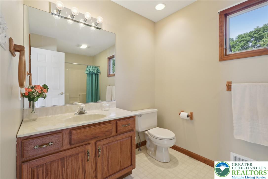 1705 Deer Path Road Easton, PA 18040 - Photo 28 of 42 a bathroom with a toilet sink and mirror