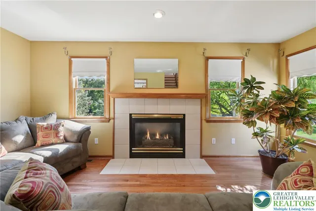 a living room with furniture and a fireplace
