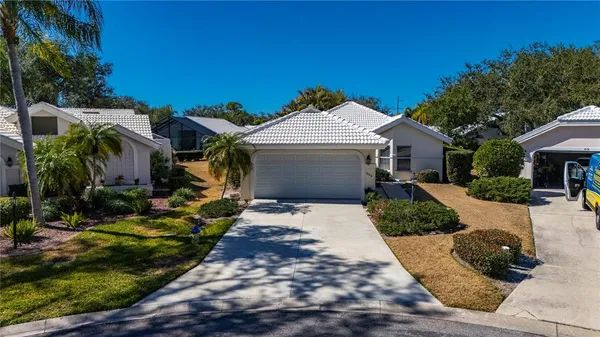 an aerial view of a house with a yard