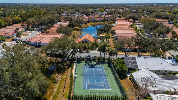 an aerial view of residential houses with outdoor space