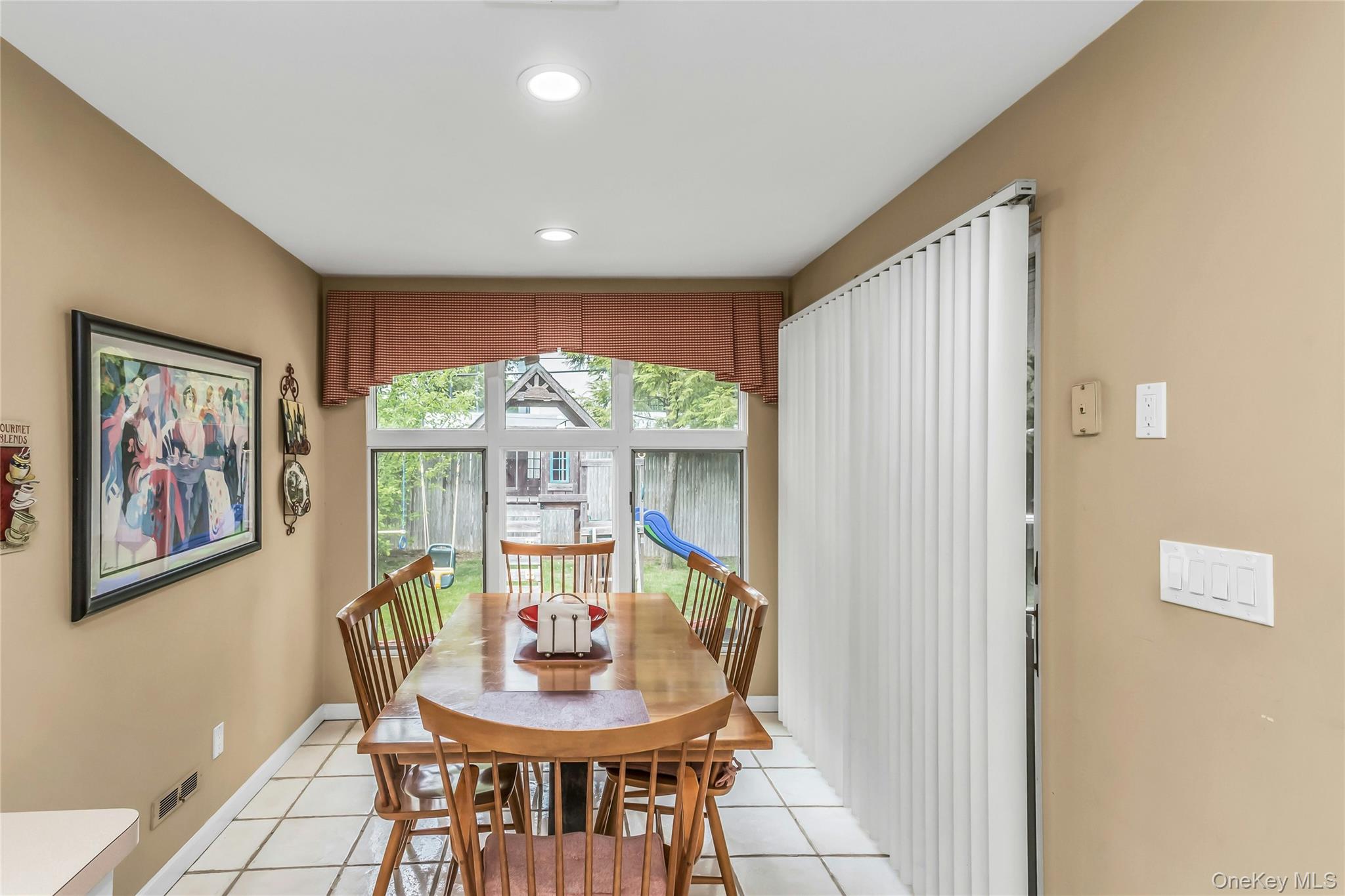 57 Joyce Road Plainview, NY 11803 - Photo 11 of 20 a view of a dining room with furniture window and outside view